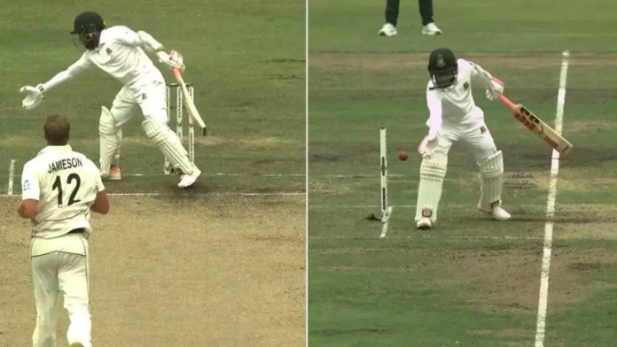 Bangladeshi batter Mushfiqur Rahim uses his hand to stop the ball and is thrown out